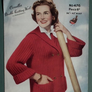 May include: A red knitted cardigan with a double-breasted closure and a large pocket on the front. The cardigan is being modeled by a woman with a smile. The text on the image reads "Conella Double Knitting Wool (a Robin product)" and "No 476 PRICE 6D 36"-40" BUST".
