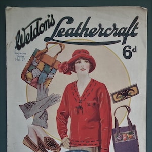May include: A vintage magazine cover for "Weldon's Leathercraft" with a woman in a red outfit and hat. It displays various leathercraft items: handbags, gloves, shoes, and a plate with roses. The price is 6d.