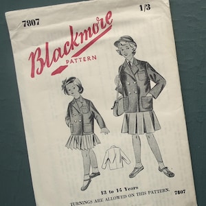 May include: Blackmore pattern 7807 for a girls' school uniform. The pattern includes a double-breasted jacket with pockets and a pleated skirt. The pattern is for sizes 13 to 14 years.