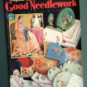 May include: A vintage magazine cover for "Good Needlework" featuring a woman sewing and various embroidered items. The cover includes the text "Delightful Wild Rose Transfer Free Inside." The magazine is dated October 1933.
