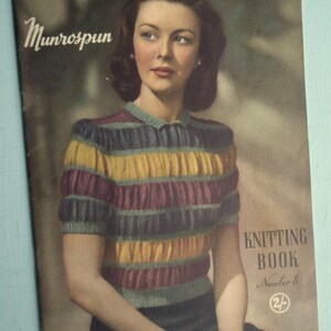 May include: A vintage Munrospun knitting book, Number 8, featuring a cover illustration of a person wearing a short-sleeved, ribbed sweater with horizontal stripes in yellow, purple, and green. The text reads Munrospun, Knitting Book, Number 8, 2/-.
