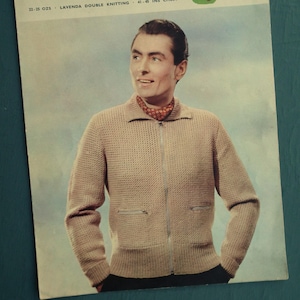 May include: Vintage knitting pattern titled "Lavenda Hand Knit" featuring a man wearing a beige zip-up sweater. The pattern details include "22-25 ozs" and "41-45 ins chest". The cover has a retro design with a green and red graphic and the number "559".