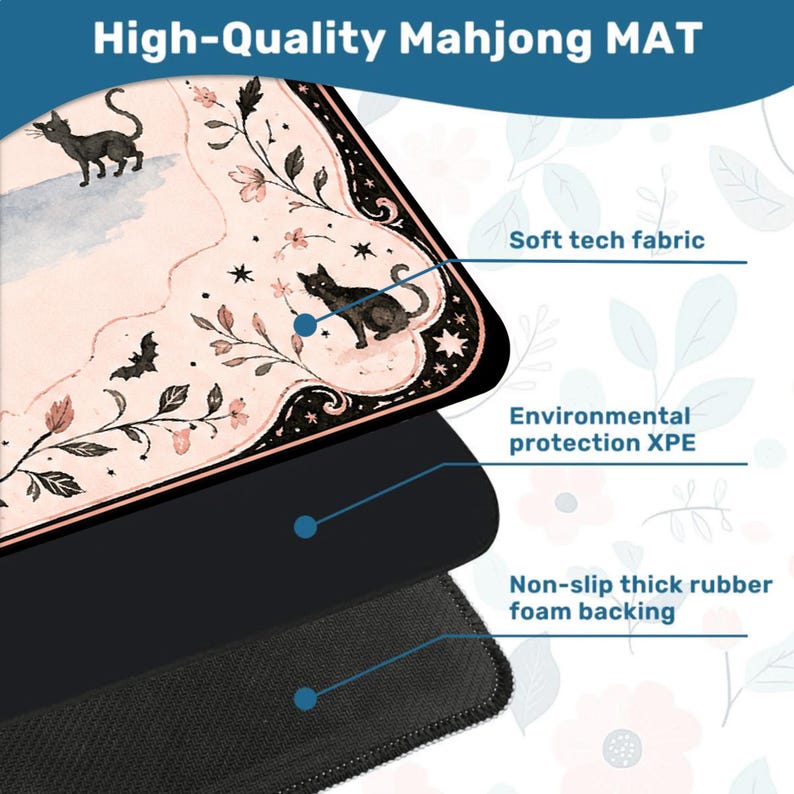 May include: A Mahjong mat featuring a pale pink surface with black cat illustrations, floral vines, and bats. The mat is composed of three layers: a soft tech fabric top, an environmental protection XPE middle layer, and a non-slip thick rubber foam backing.