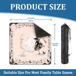 May include: A square game mat measuring 31.5 inches by 31.5 inches with a pale pink surface featuring a skeleton, a ghost, and a witch with a broom. The mat has a black underside and comes with a black cylindrical carrying bag with a shoulder strap.