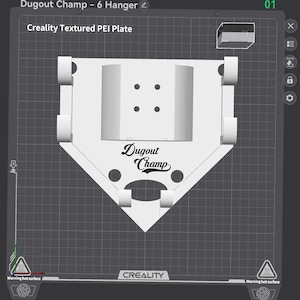 May include: A white 3D-printed baseball dugout hanger with the text "Dugout Champ." The design includes a home plate shape and six hanger slots. The image also shows the text "Creality Textured PEI Plate."