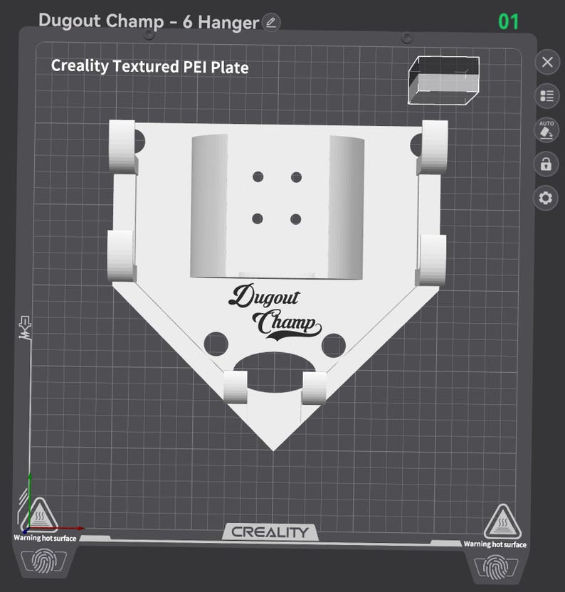 May include: A white 3D-printed baseball dugout hanger with the text "Dugout Champ." The design includes a home plate shape and six hanger slots. The image also shows the text "Creality Textured PEI Plate."