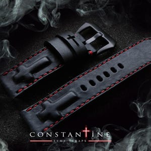 May include: Black leather watch strap with red stitching and a black buckle. The strap features embossed cross designs and is branded with the text "CONSTANTINE TYME STRAPS".