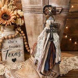 May include: A rustic wooden sign with the text "Welcome to our home" in white lettering. The sign features a distressed finish and a simple, inviting design, perfect for a front porch or entryway.