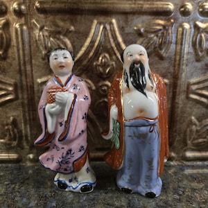 Two Vintage/Antique Porcelain Figurines of the Eight Immortals from Chinese Mythology, He Xiangu (female) and Zhongli Quan (male)
