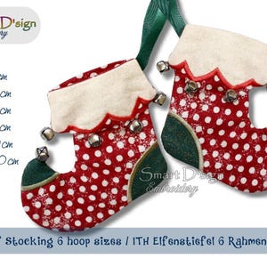 Puede incluir: Dos calcetines de elfo navideños con lunares rojos y blancos, detalles verdes y cascabeles plateados. Los calcetines tienen un puño blanco con un borde festoneado y una cinta verde para colgar. El texto de la imagen dice "ITH Elf Stocking 6 hoop sizes".