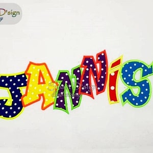 May include: Embroidered name "Jannis" in a colorful, bold, and playful font. Each letter is outlined in a bright color and filled with white polka dots on a colorful background.