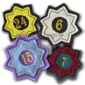 May include: Four felt star-shaped badges with different colored backgrounds and numbers in the center. The numbers are 24, 6, 15, and 7. The badges are sewn with a decorative stitch around the edges.
