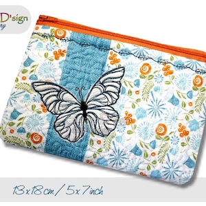 May include: A blue and white zippered pouch with a floral pattern and a black and white butterfly embroidery. The pouch measures 13x18 cm.