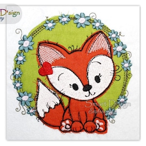 May include: Embroidered design of a cute orange fox with a red heart on its head, sitting inside a green circle with blue and white flowers.