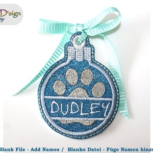 May include: A blue and white Christmas ornament with a paw print and the name "DUDLEY" embroidered on it. The ornament is attached to a light blue ribbon.