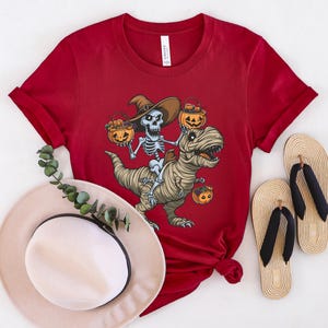 Skeleton Riding Mummy Dinosaur T rex Halloween Funny Pumpkin T-Shirt