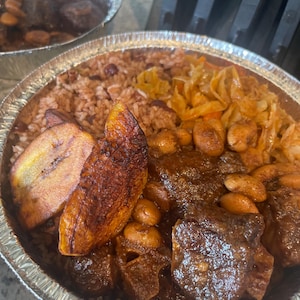 Frozen oxtail meal with rice & peas, steamed vegetables, sweet fried plantain and drink