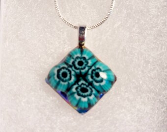 Fused millefiori glass pendant. 2 x 2 cms approx. Sterling silver plated chain. Boxed as shown. Beautiful, unique gift. Christmas. Anytime.