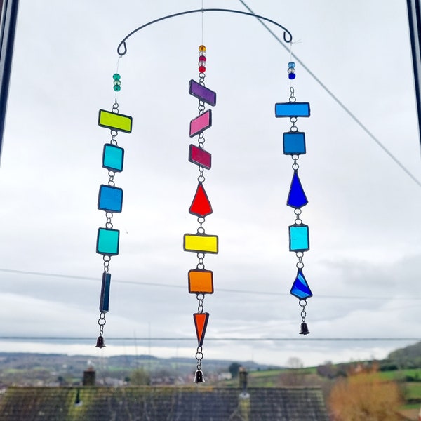 3 strand stained glass pieces mobile with bells and crystal beads. 34.0 x 21.0 cms. Colourful, unusual, unique. Reflects colour.
