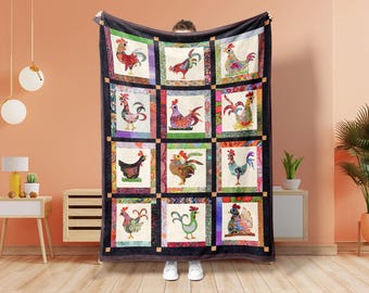 May include: A large, rectangular quilt featuring a patchwork design of colorful rooster illustrations. Each rooster is unique, set against a cream background, and framed by a black border. The quilt is held up by a person.