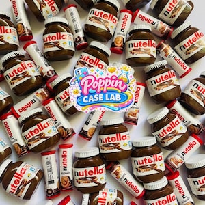 May include: A collection of Nutella hazelnut spread jars and Nutella biscuit tubes arranged on a white surface, featuring a central sticker with the text Poppin CASE LAB in blue, pink, and yellow colors with various graphic icons.