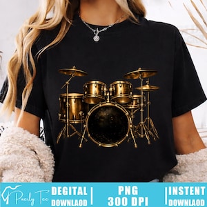 May include: Black t-shirt featuring a detailed gold-colored drum set graphic. The drum set includes drums, cymbals, and stands. The shirt also has text at the bottom that reads "DIGITAL DOWNLOAD", "PNG 300 DPI", and "INSTANT DOWNLOAD".