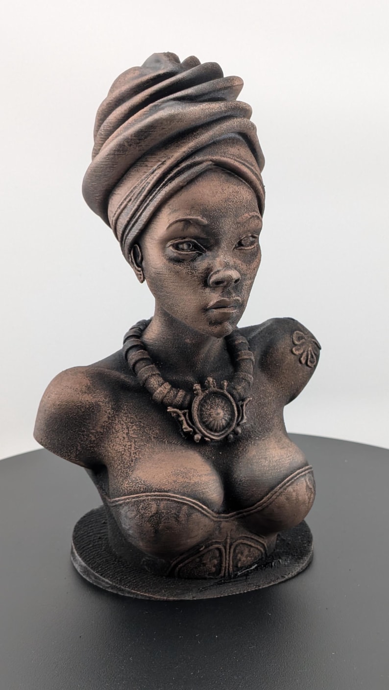 Bronze-toned African sculpture bust of a regal Black woman in a layered headwrap with beaded necklace; decorative home decor for mantel or living room.