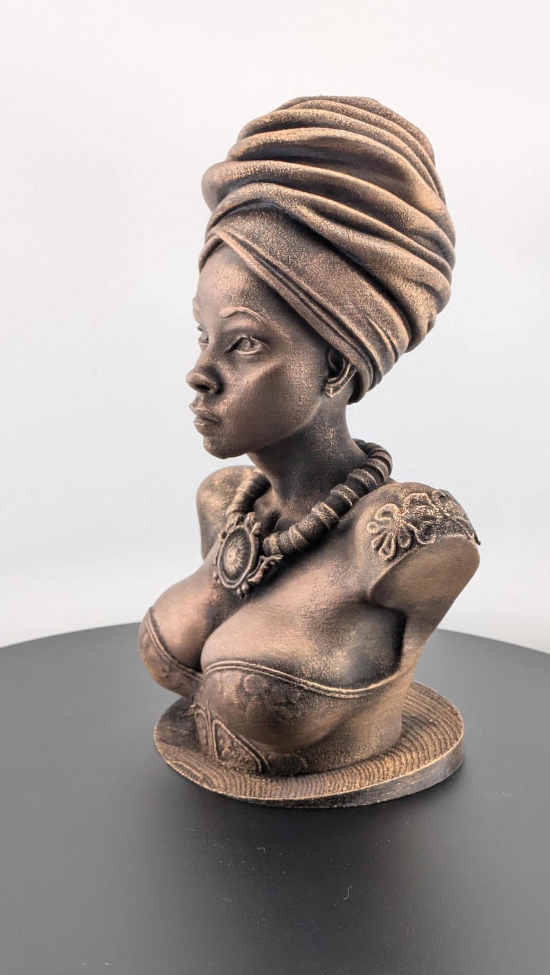 Bronze-toned African sculpture bust of a regal Black woman in a layered headwrap with beaded necklace; decorative home decor for mantel or living room.