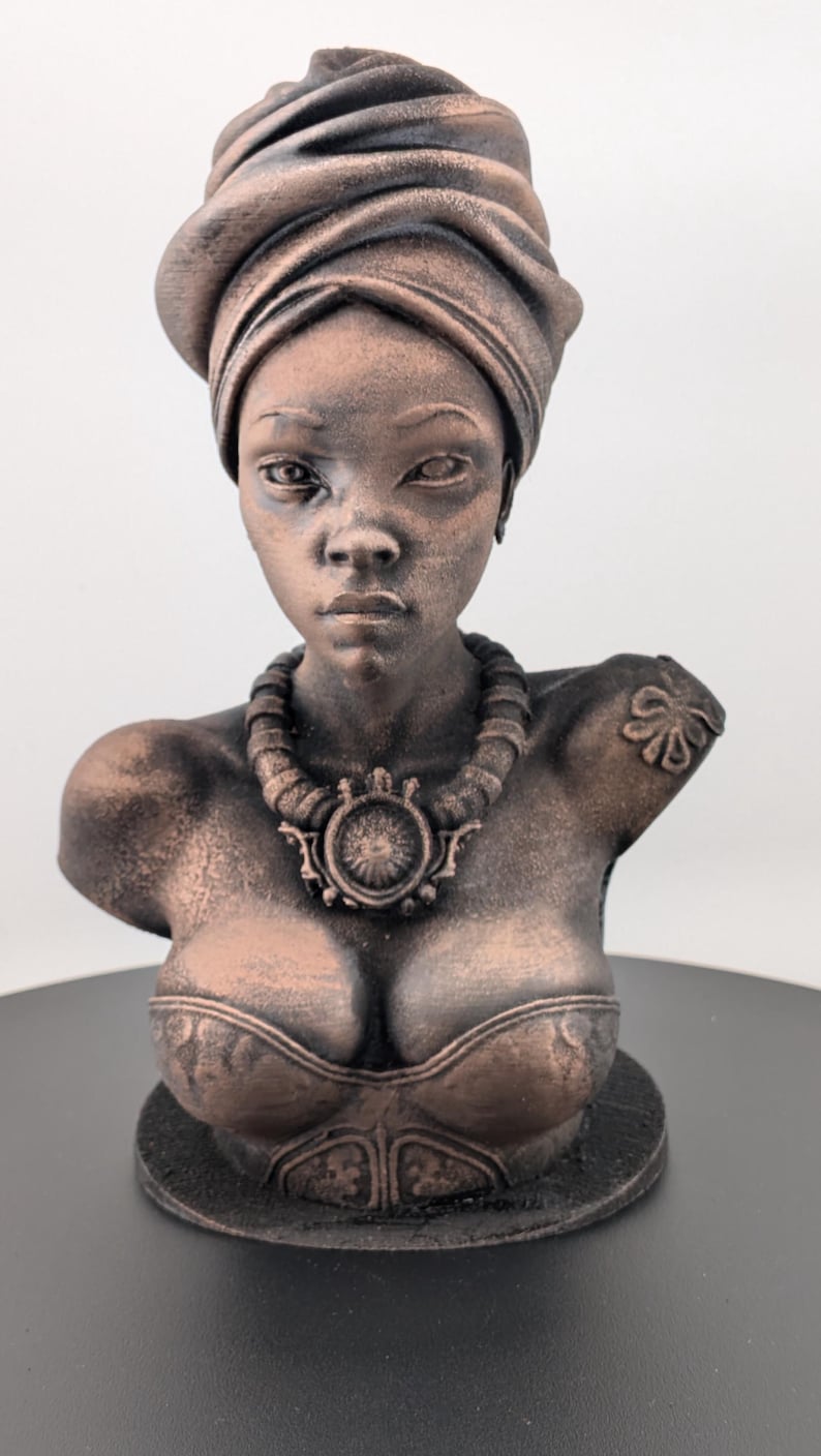 Bronze-toned African sculpture bust of a regal Black woman in a layered headwrap with beaded necklace; decorative home decor for mantel or living room.