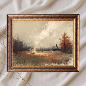 Peut inclure: Peinture de paysage encadrée représentant une scène rurale avec un feu de joie, une petite cabane et un arbre aux feuilles orangées. L'œuvre d'art a une palette de couleurs chaudes avec des tons bruns, oranges et beiges. Le cadre est de couleur or foncé.