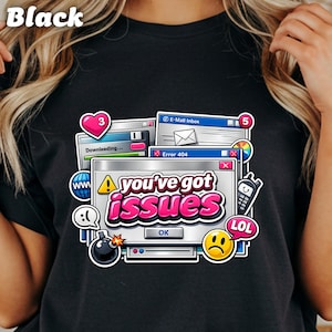May include: Black t-shirt with a colorful graphic featuring computer-themed elements. The design includes the text "you've got issues" in pink, along with icons like a heart, email inbox, and a sad face.