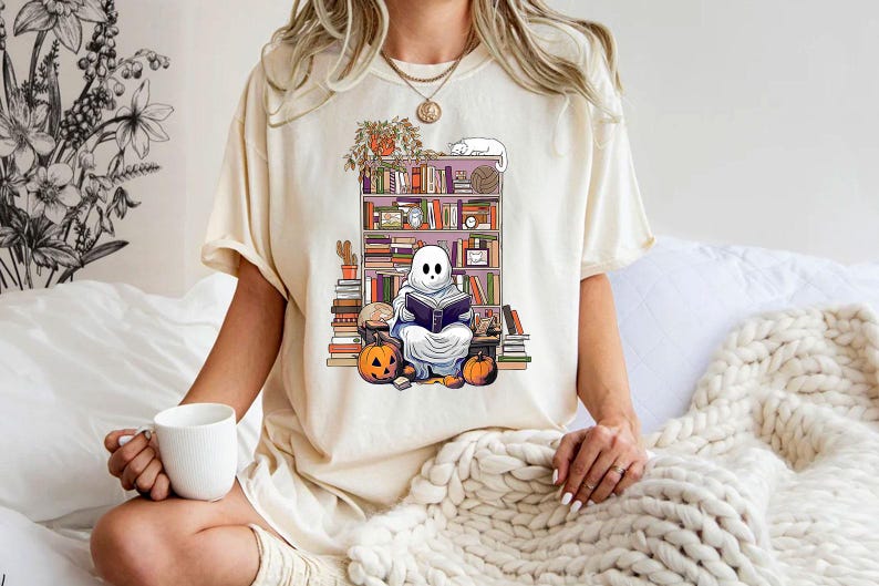 a woman sitting on a bed holding a cup of coffee