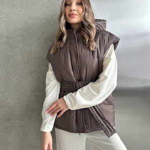 Today's down vest with a belt: adding comfort and style for cold days