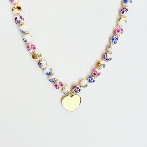 Porcelain Floral Bead Choker with Gold-Plated Heart Charm