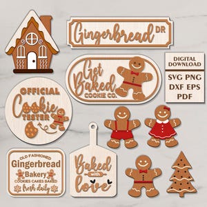 Puede incluir: Un conjunto de 10 archivos de corte digital con diseños de temática de pan de jengibre. Los diseños incluyen una casa de pan de jengibre, hombres y mujeres de pan de jengibre, un árbol de Navidad y letreros que dicen "Get Baked Cookie Co.", "Official Cookie Tester", "Old Fashioned Gingerbread Bakery" y "Baked with Love".