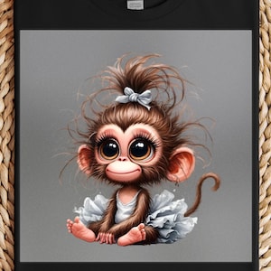 May include: A black t-shirt featuring a cartoon monkey with large eyes, wearing a white dress and a blue bow. The monkey has brown fur and is sitting down. The background is a gradient gray.