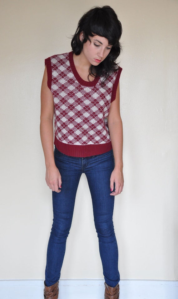 sweater with plaid shirt underneath