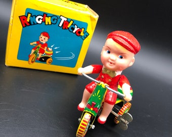 Vintage Wind-Up Toy, Boy on a bike with key