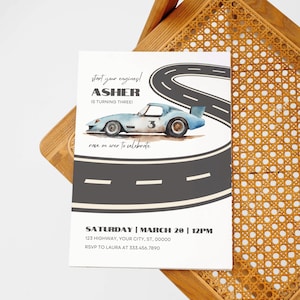 May include: A birthday party invitation with a blue race car on a gray racetrack. The invitation says "Start your engines! Asher is turning three! Race on over to celebrate." The date and time of the party are listed as "Saturday, March 20, 12PM". The address is "123 Highway, Your City, ST, 00000". The RSVP information is "RSVP to Laura at 333.456.7890".
