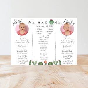 May include: A pink and green illustrated card with the text "We Are One" and two photos of babies. The card includes information about the babies' birth dates, weights, heights, and other milestones. The card is decorated with cactus illustrations.