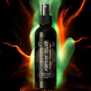 May include: A black body spray bottle with a clear cap, labelled "FORTUNE TELLER" with "Orange, Patchouli, Pine" scent. The bottle is set against a dark background with orange and green flame-like effects. The label also reads "Alcohol Free" and "100ml".