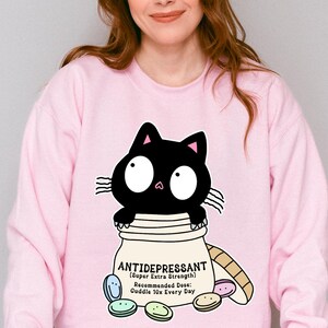 猫を抗うつ薬として、大学時代のスウェットシャツ、毛皮の飼い主へのプレゼント、猫ママ、猫パパ、猫好きのための面白いセーター、かわいいシャツ、メンタルヘルスのユーモア