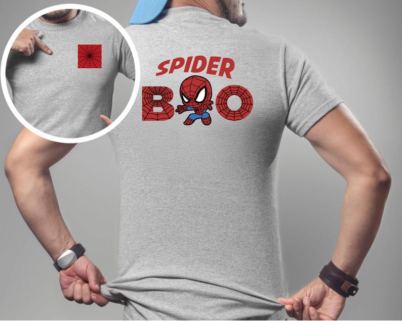 Puede incluir: Camiseta gris claro con un dise&ntilde;o de telara&ntilde;a roja en el bolsillo delantero y un gr&aacute;fico m&aacute;s grande en la espalda. El gr&aacute;fico de la espalda dice "SPIDER BOO" con un personaje de dibujos animados de Spider-Man.