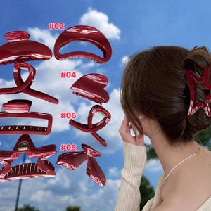 May include: Eight red plastic hair clips in various shapes and sizes. The clips are numbered 1 through 8.