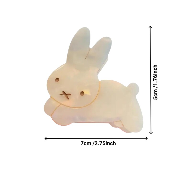 May include: A white ceramic bunny rabbit figurine with a simple design. The figurine is 2.75 inches wide and 1.76 inches tall.