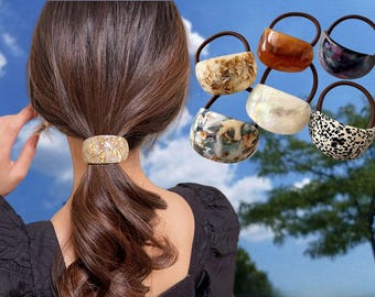 Elástico de cabelo oval em acetato: elegante prendedor de rabo de cavalo para mulheres.