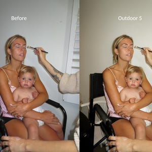 May include: A woman and a child sitting on a black chair. The woman is wearing a pink tank top and the child is wearing a white tank top. The woman is holding the child in her arms. The woman is having makeup applied to her face.