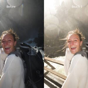 May include: A woman with a white shirt and a black backpack smiles while standing on a wooden walkway near a waterfall. The caption "Beach 1" is visible in the background.