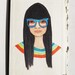 original art: girl in glasses and a rainbow sweater, she's such a hipster. Illustration by Julie Tillman