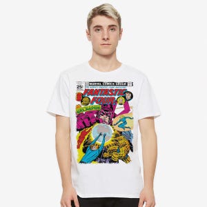 May include: White t-shirt with a comic book design. The graphic features the words "Fantastic Four" and comic book characters. The shirt is a crew neck style and is being worn by a person.